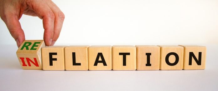 Inflation,Or,Reflation,Symbol.,Businessman,Turns,Cubes,And,Changes,The